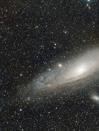 A hazy white galaxy amidst stars